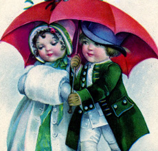 Boy and Girl under umbrella in snow