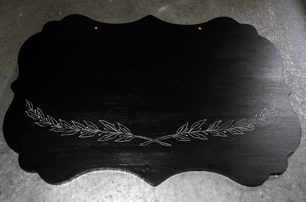 Chalkboard plaque with laurel wreath design