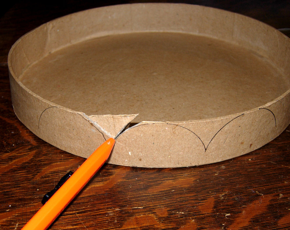 Cutting scalloped edge in papier-mâché lid