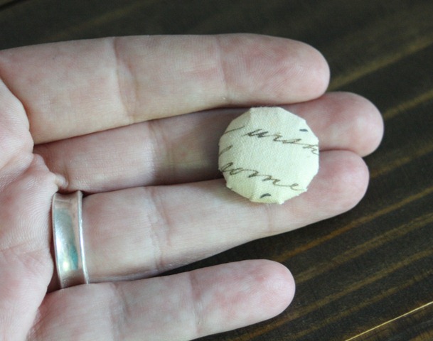 Button covered with fabric