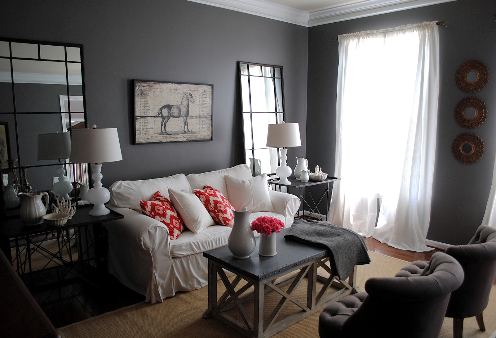 dark Gray painted living room with white furniture and lamps