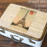 Sheet music covered suitcase