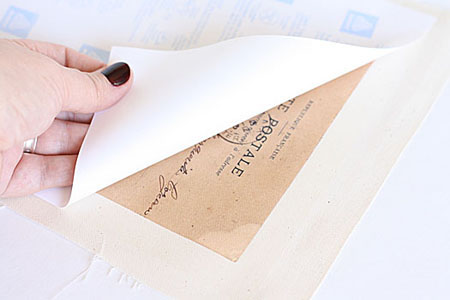 Peeling back paper to reveal transfer
