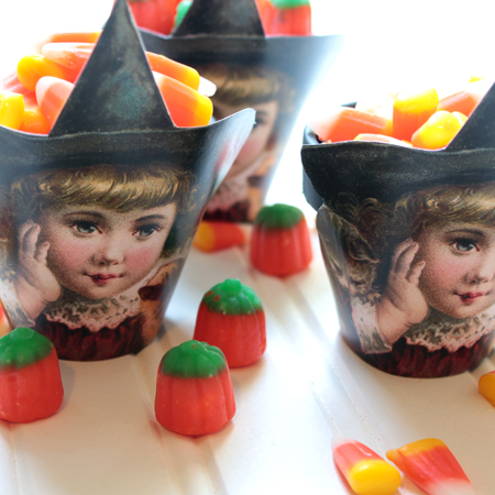 close up of cute witch halloween candy cups with candy