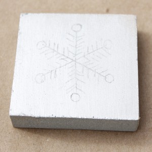 Snowflake design on wood block