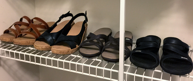 Croc sandals on closet shelf