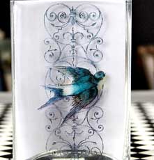 Bird on glass vase