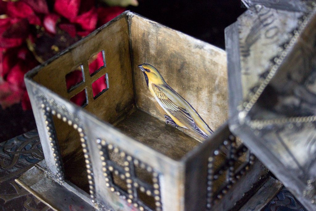 Craft house with bird inside