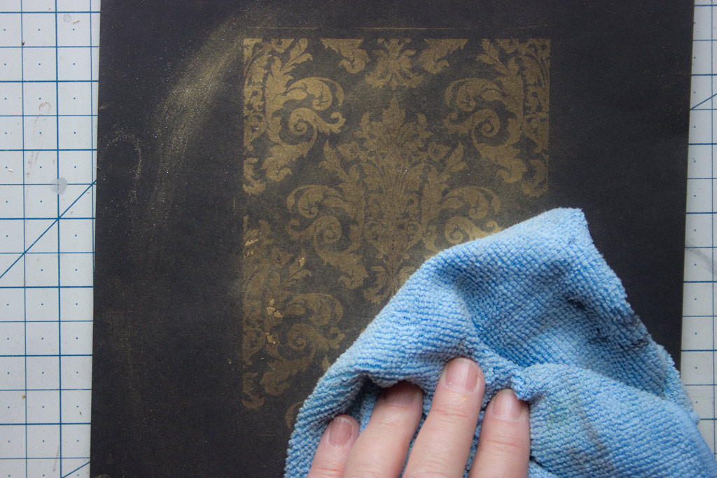 Appling gilding wax to damask
