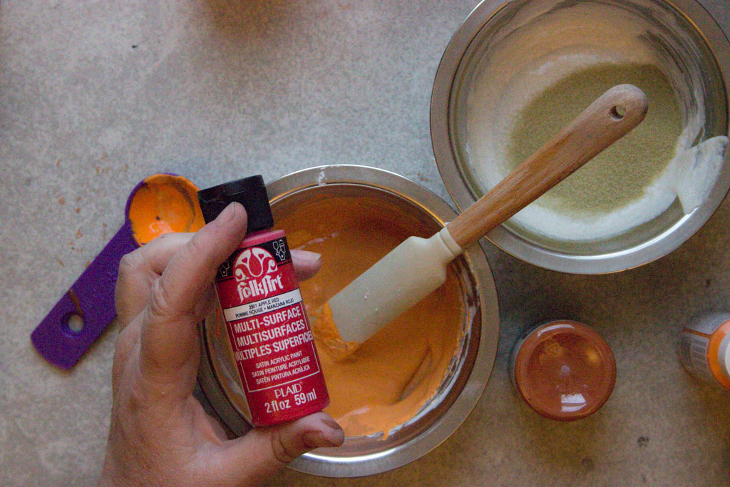 mixing red paint into pastes