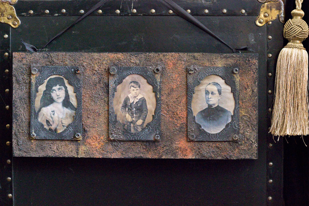 Rust paste board with antique photos of people
