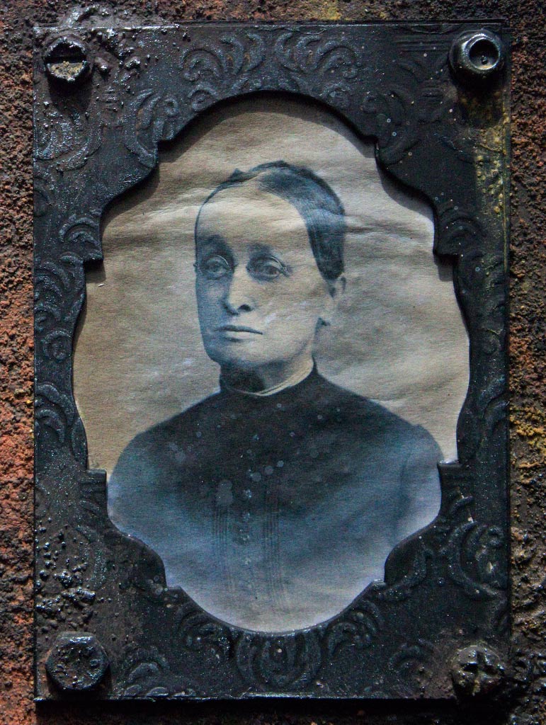 Rust paste board with antique photo of lady