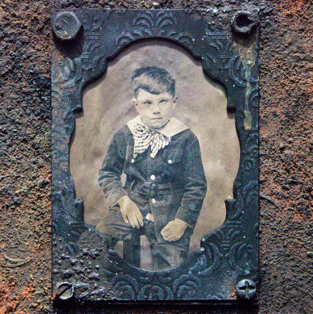 Rust paste board with antique photo of boy