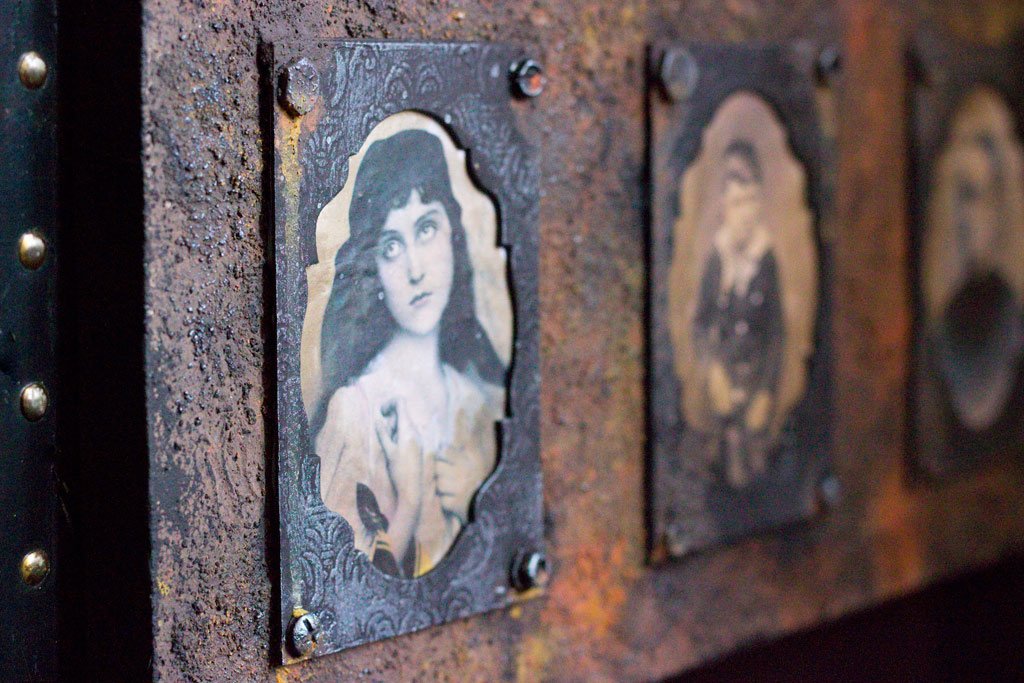 Rust paste board with antique photos of people