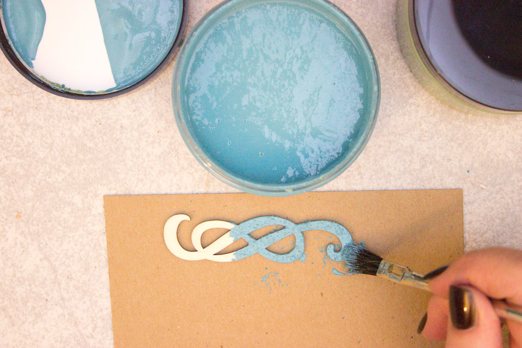 adding blue patina to wooden ornament