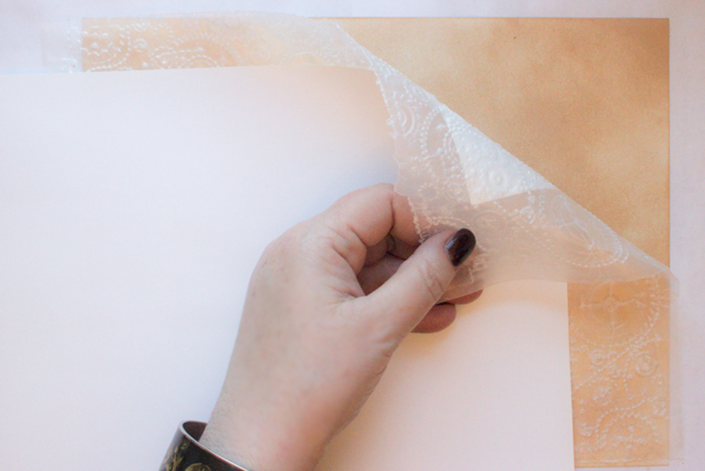 sandwiching wax paper over distressed ink paper