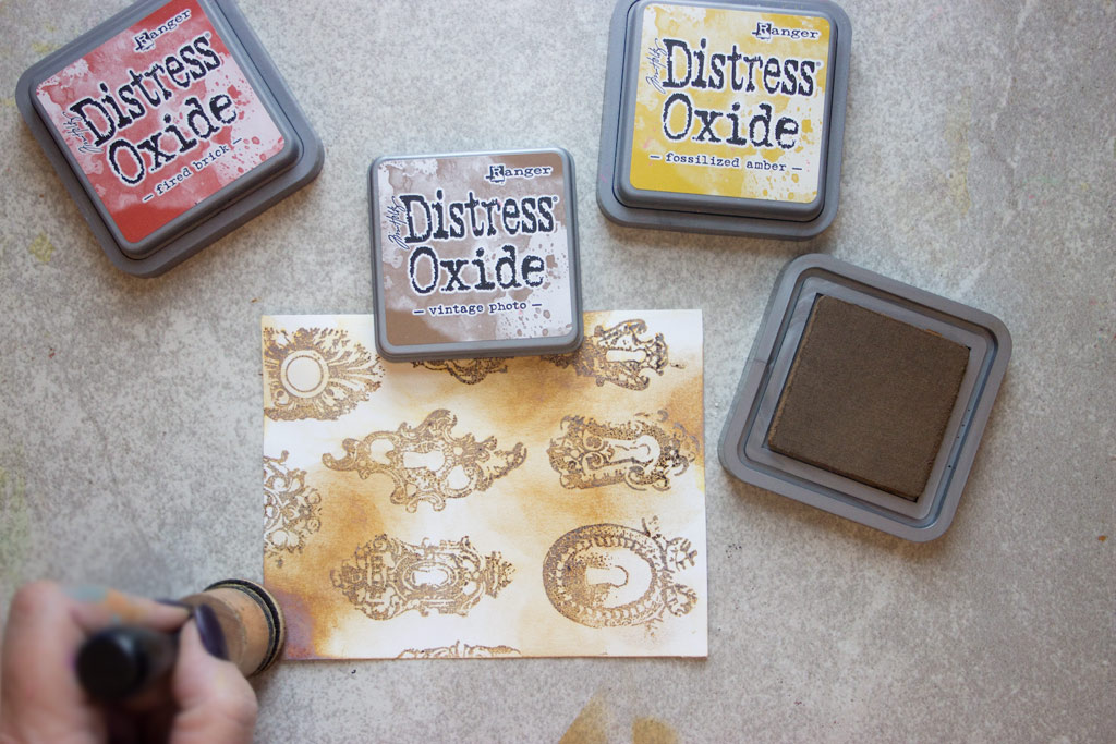 gold stamped designs on paper, with distress oxide ink