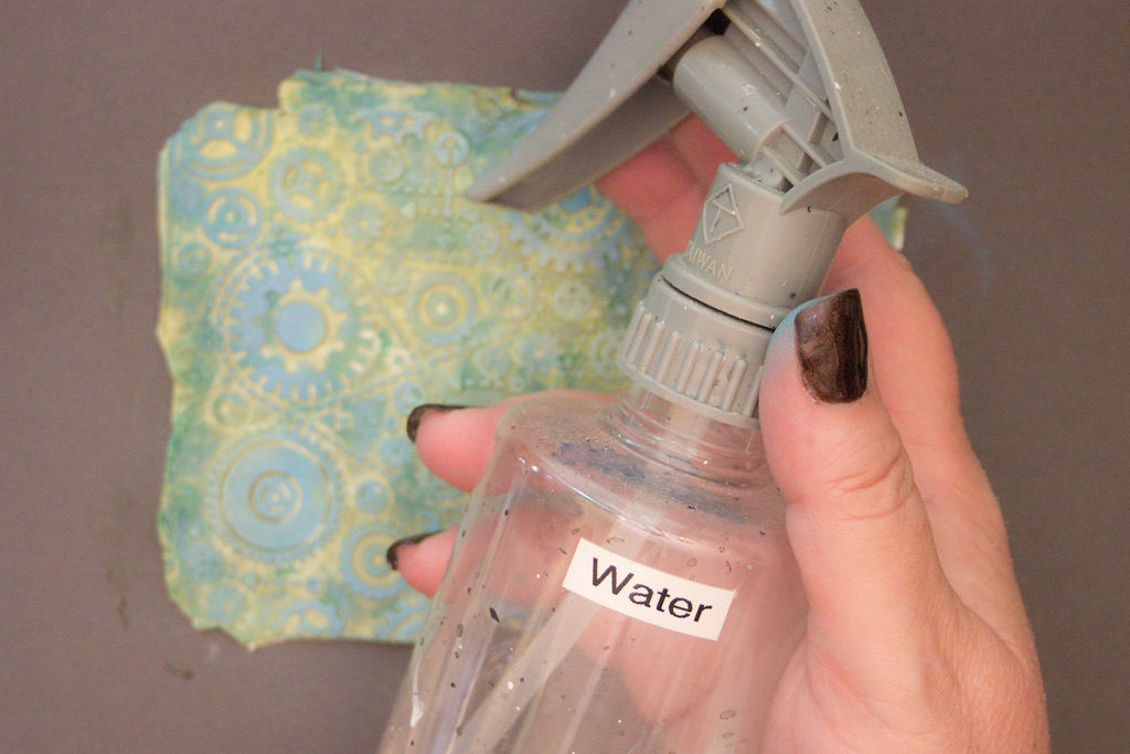 spray bottle with water and clay