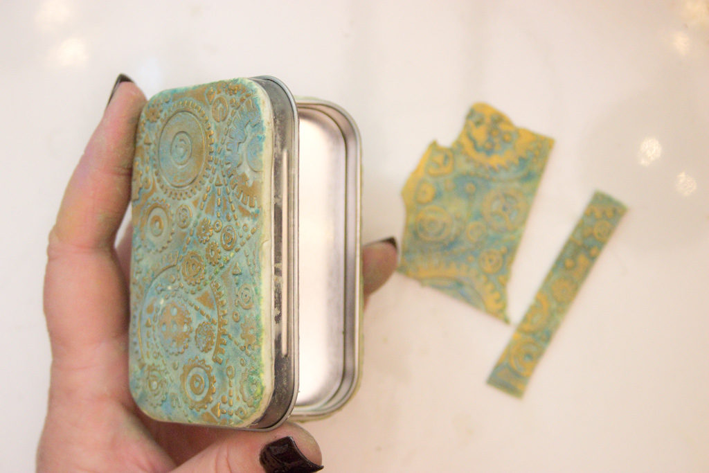 Altoid tin with clay opened
