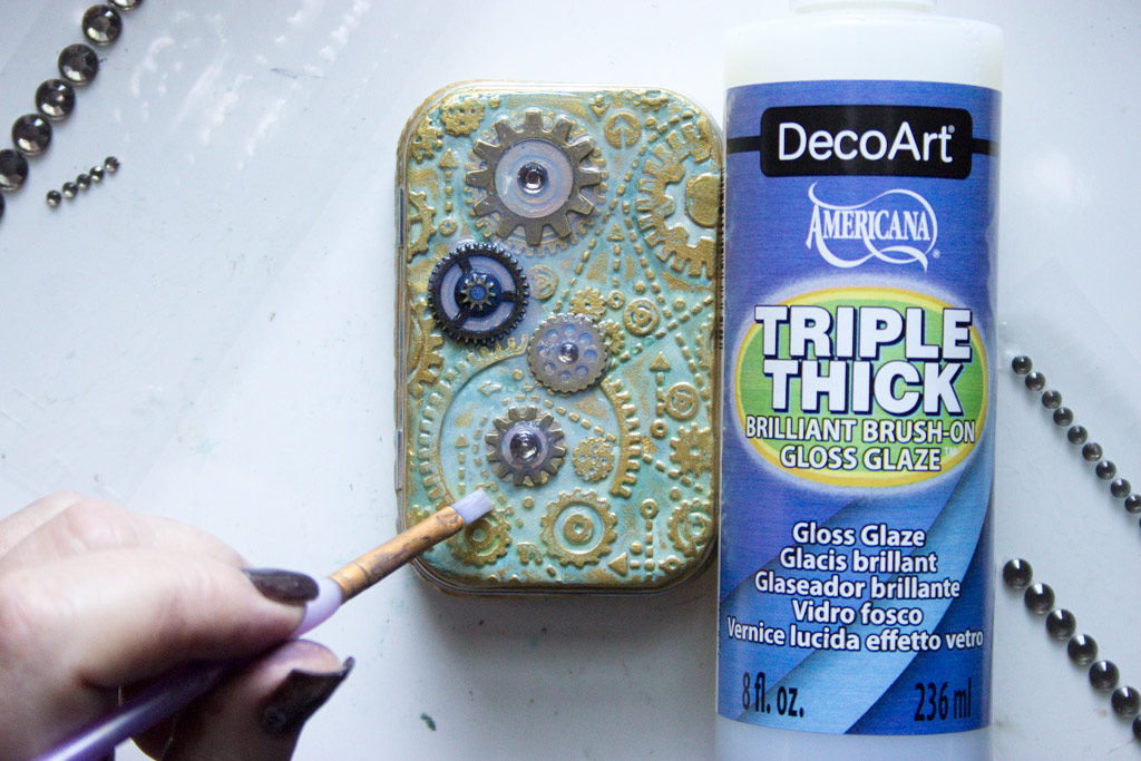 Adding triple thick glaze to clay on altoid tin