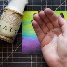 Watercolor Salt Effect Technique with hand holding salt