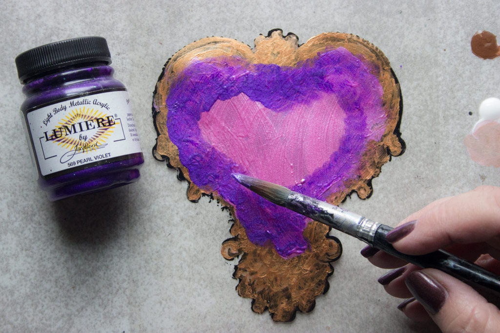adding purple paint to gold frame