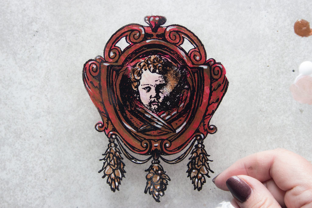 Acetate framed Cherub with red paint