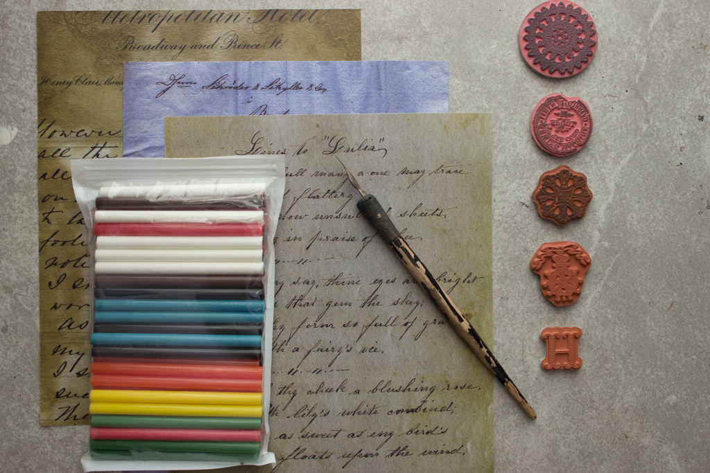 wax seal supplies with old letters and rubber stamps