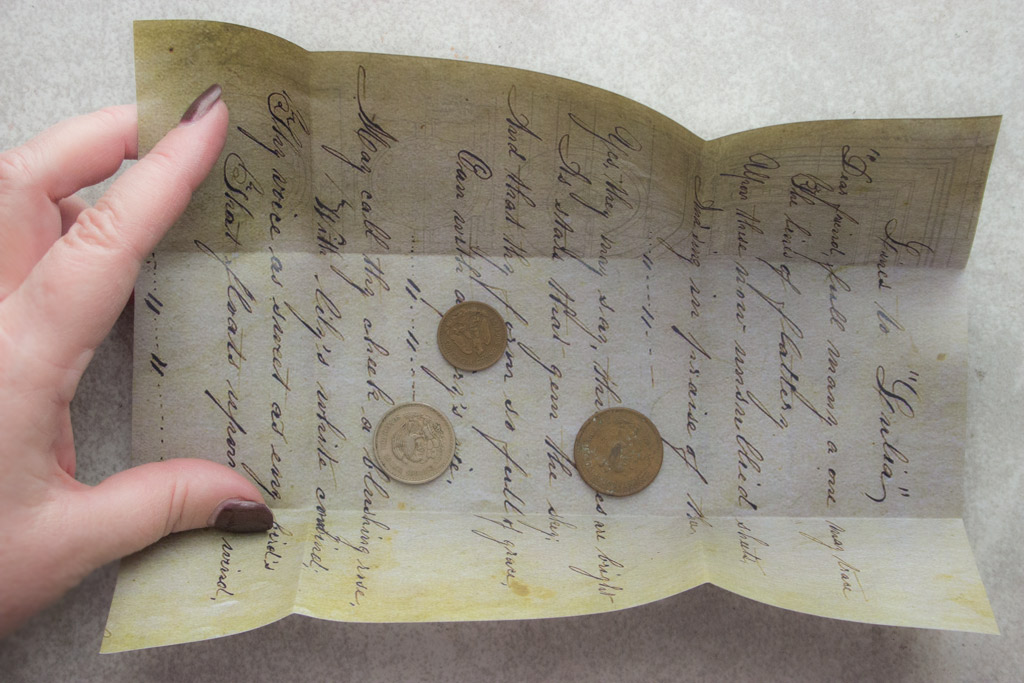 Letter folded with coins inside
