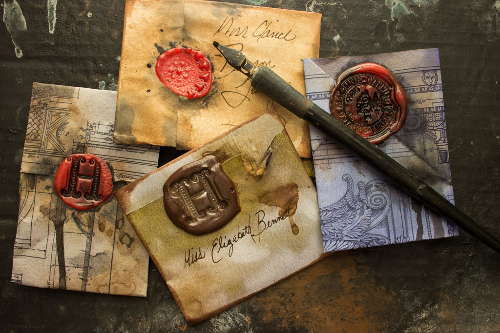 letters with faux wax seals and pen