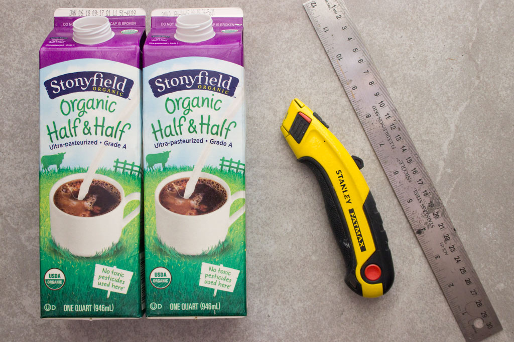 milk cartons with knife and ruler