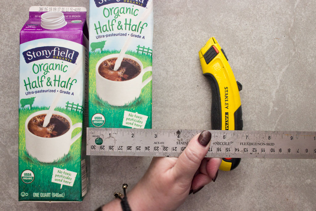 milk cartons with knife and ruler