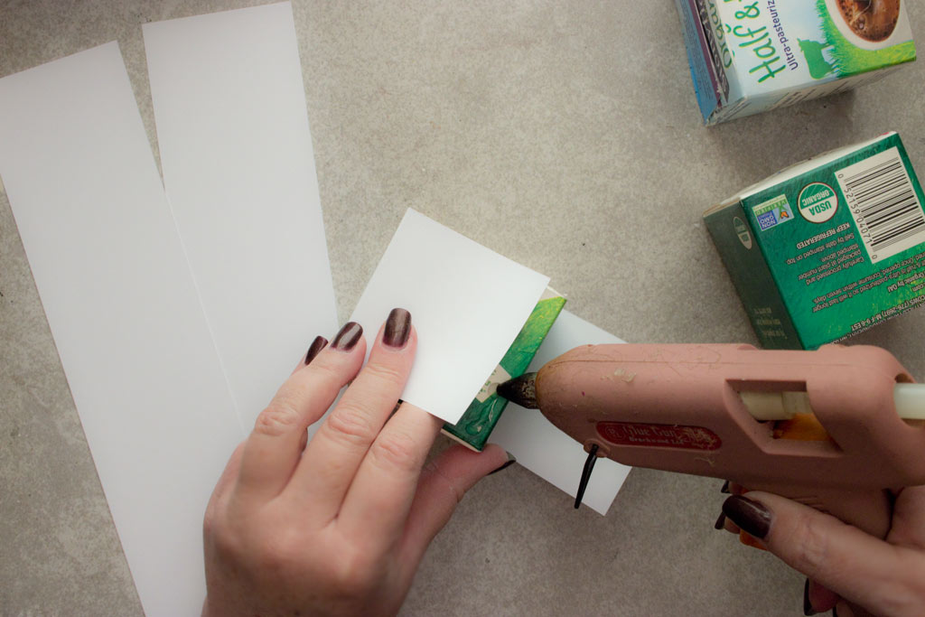 Gluing paper to box with glue gun