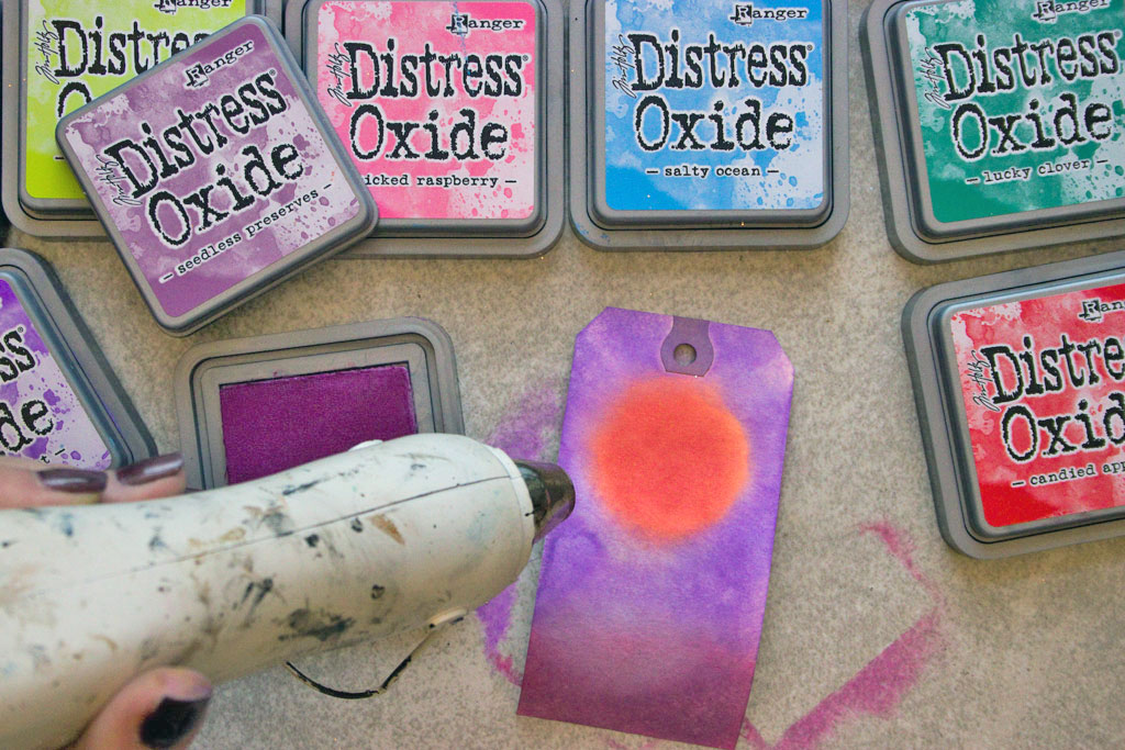 heating tag with heat gun and tim holtz distress oxide ink pads
