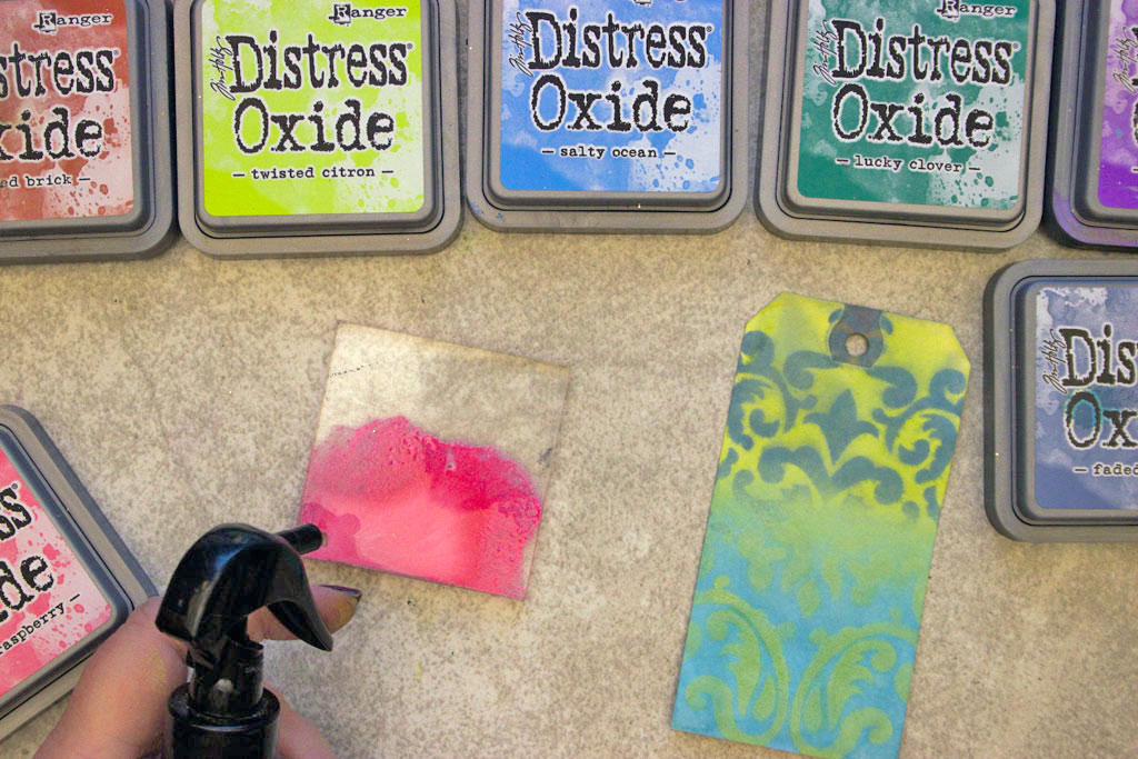distress ink with tag and acrylic block and spray bottle