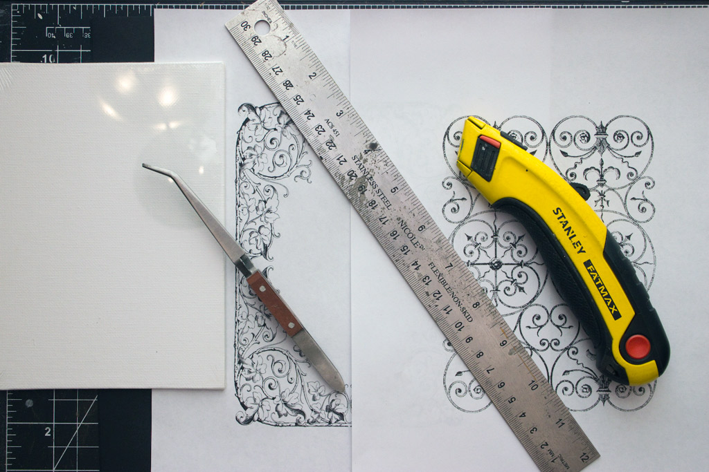 wrought iron design on paper with ruler and knife