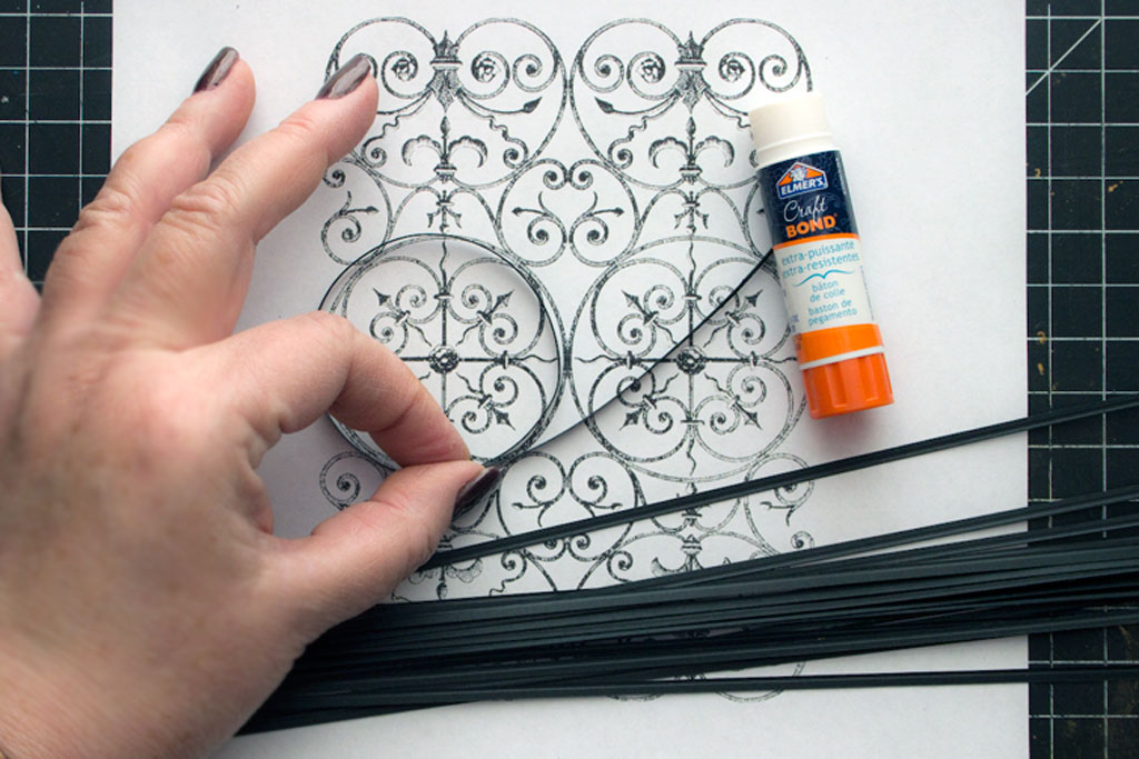 wrought iron design on paper with paper strips and glue