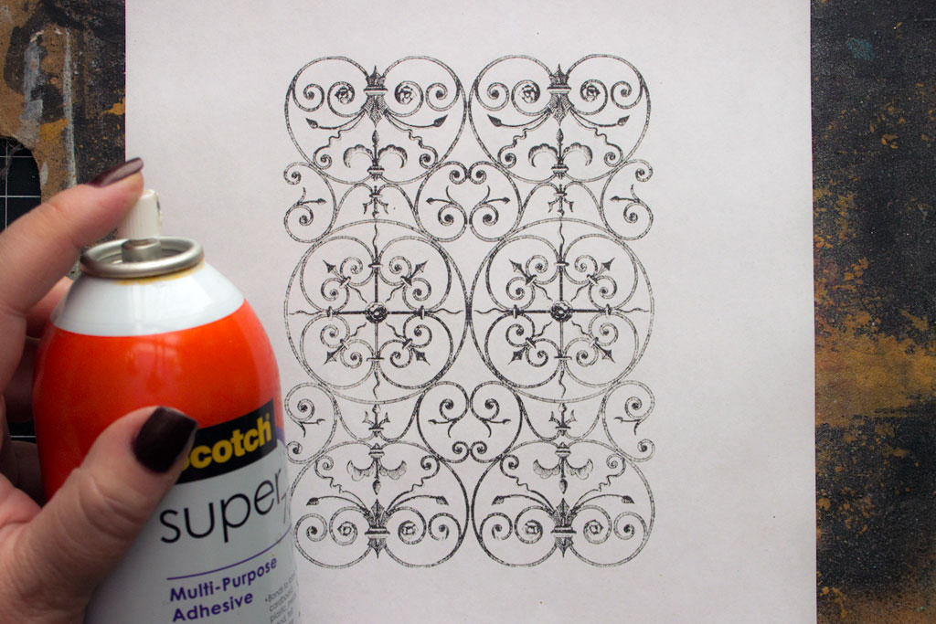 wrought iron design on paper with spray adhesive