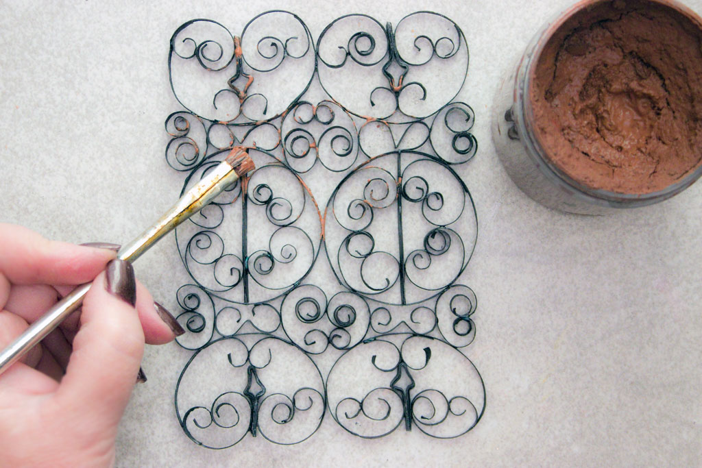 adding paint to wrought iron paper design