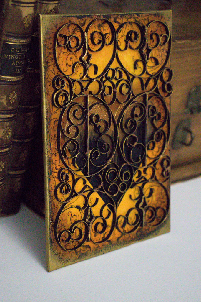 finished card with paper wrought iron on books
