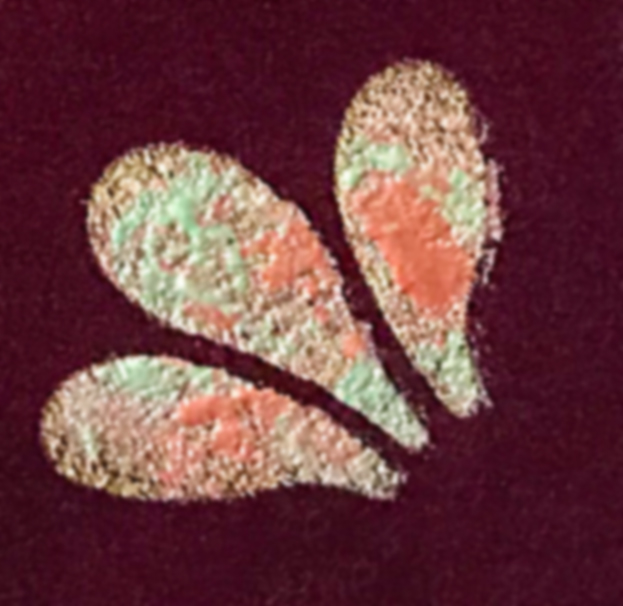 close up of stenciled design on velvet