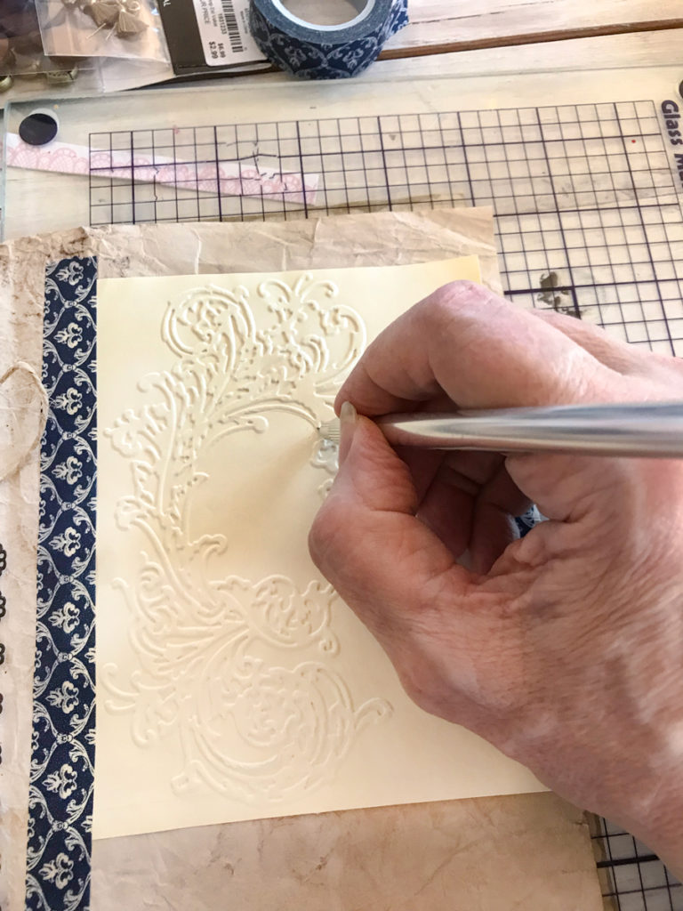 embossed card with tool and cutting mat