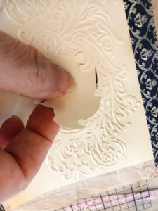 cutting out embossed card
