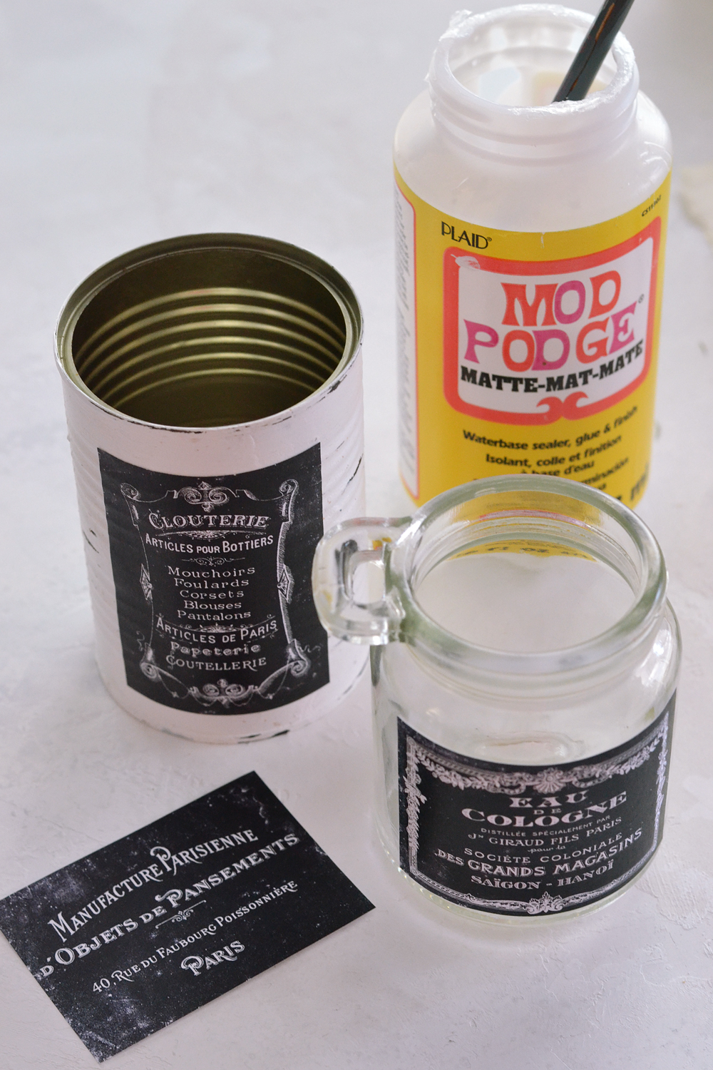 Gluing labels to cans and jars