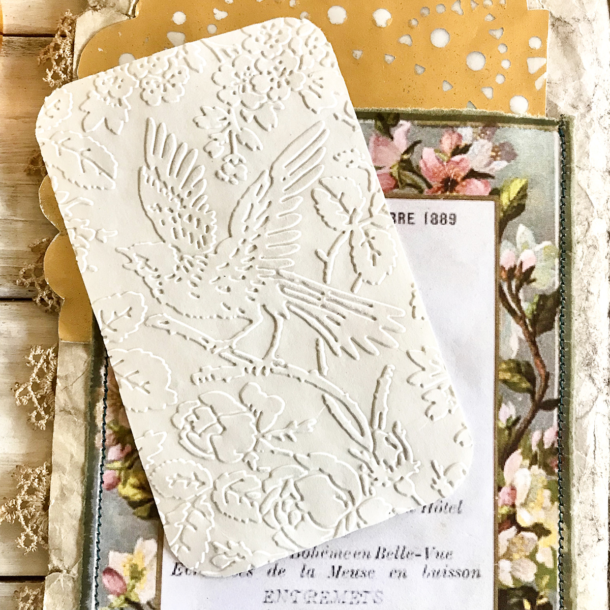 embossed bird card with papers