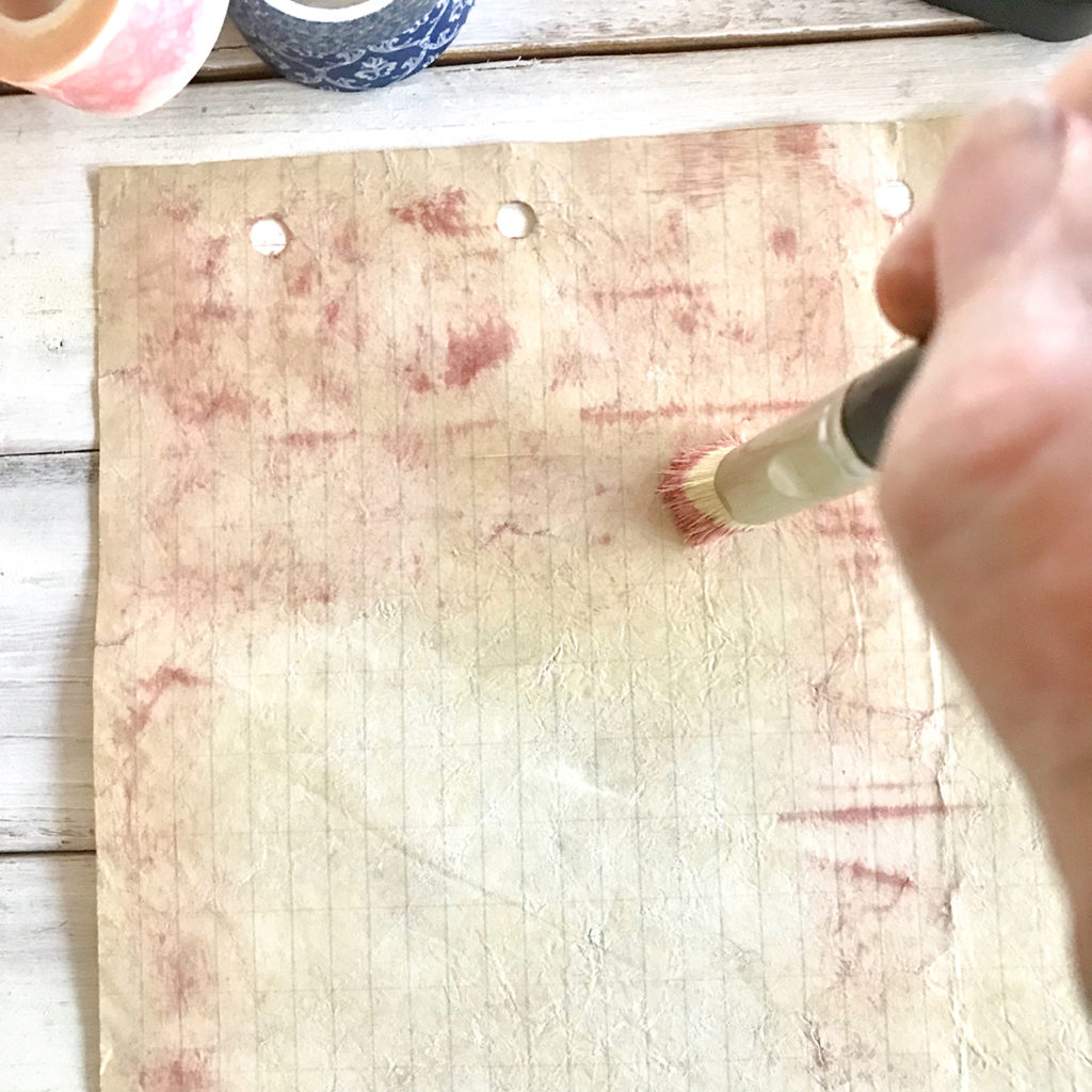 painting paper with brush