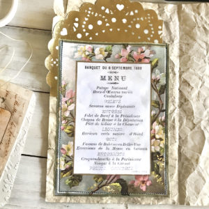 Menu on doily and paper stack