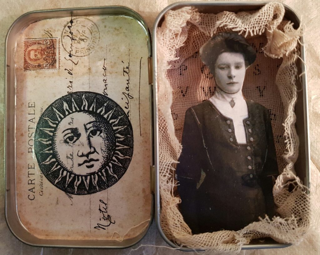 Altoid tin shadow box with lady and sun