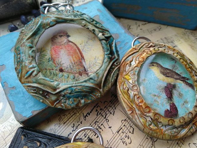 Bird pendants on table on sheet music