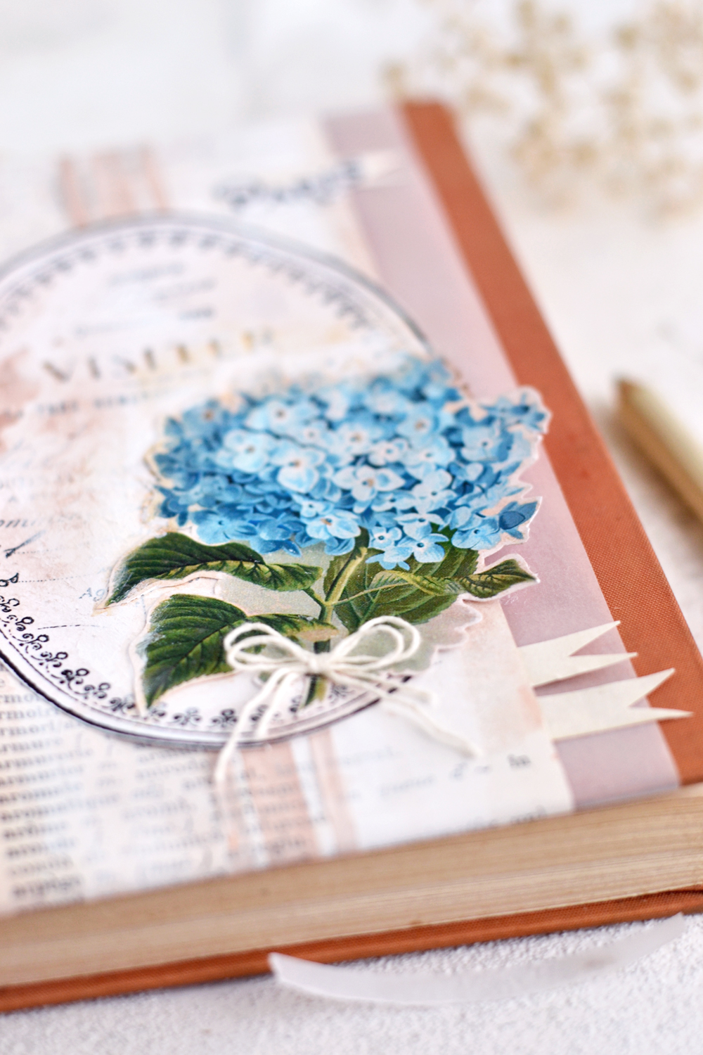 DIY Vintage French Art Journal Cover - learn how to easily make this DIY project using supplies that you might have around and an old dictionary! #DIY #vintage #freeprintable #hydrangea #artjournal #junkjournal 
